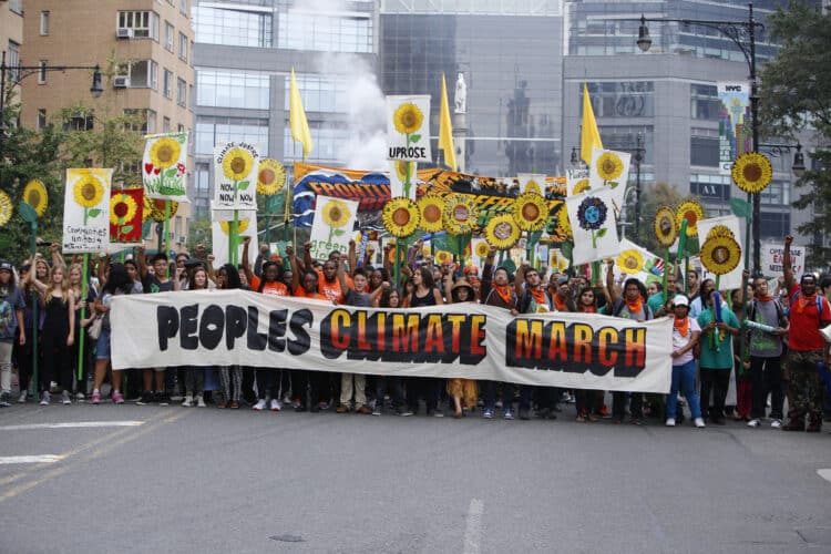 Demonstration with sign reading People's Climate March
